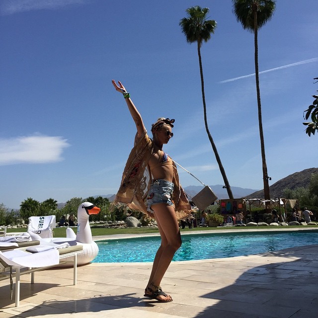 Cailin Russo poses poolside during Coachella weekend