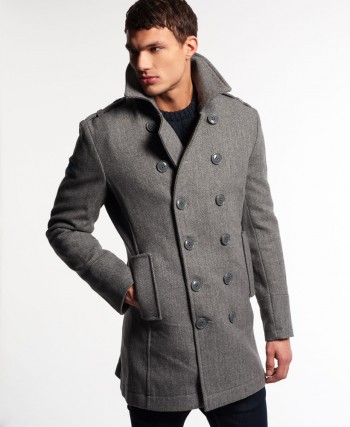 Superdry men's Bridge coat. This wool rich coat features a Superdry logo patch under the collar, a button fastening, two front pockets and a single inner pocket. The Bridge coat is finished with a metal Superdry logo badge on the sleeve.