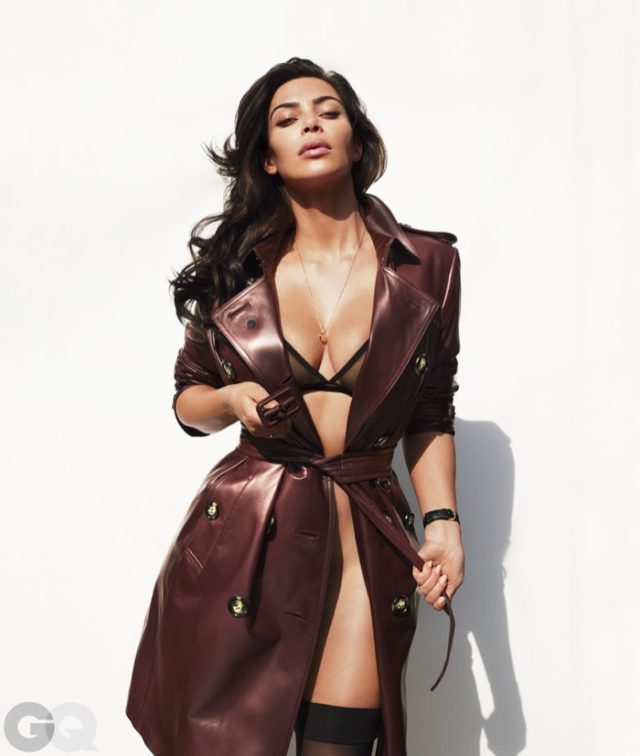 Kim Kardashian poses in Burberry trench coat with Eres bra