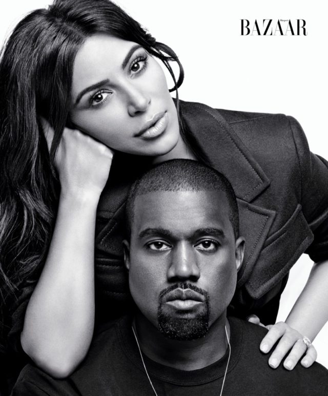 Kim Kardashian poses with husband Kanye West in Prada jacket