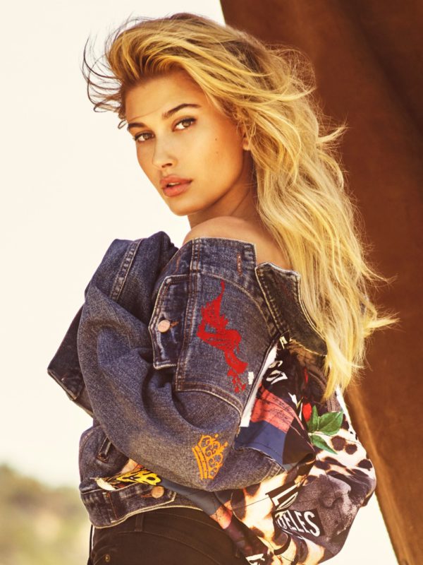 Hailey Baldwin poses in embellished denim from Guess Jeans
