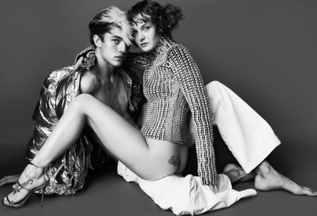 Joined by Lucky Blue Smith, Kacy Hill wears Balenciaga sweater with Giuseppe Zanotti sandals