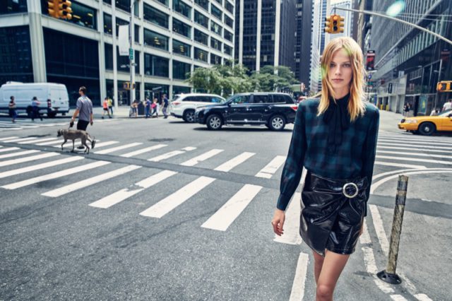Lexi Boling wears plaid shirt and faux leather skirt from Mango