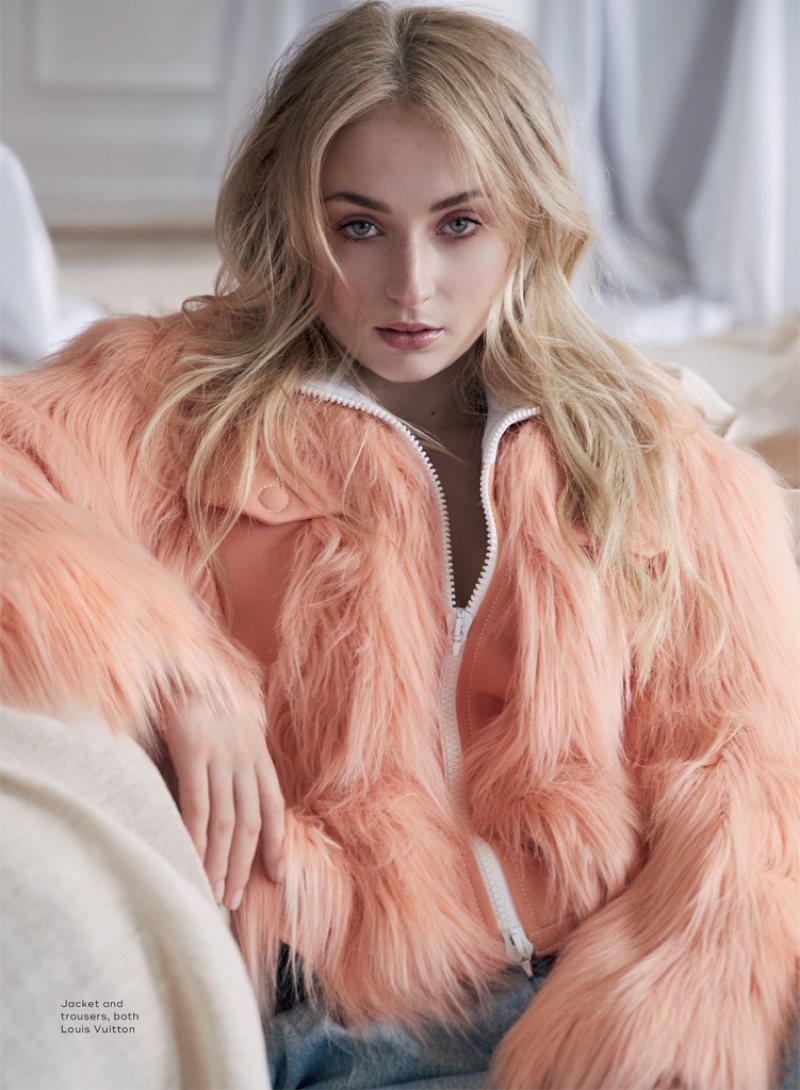 Sophie Turner poses in Louis Vuitton jacket and pants