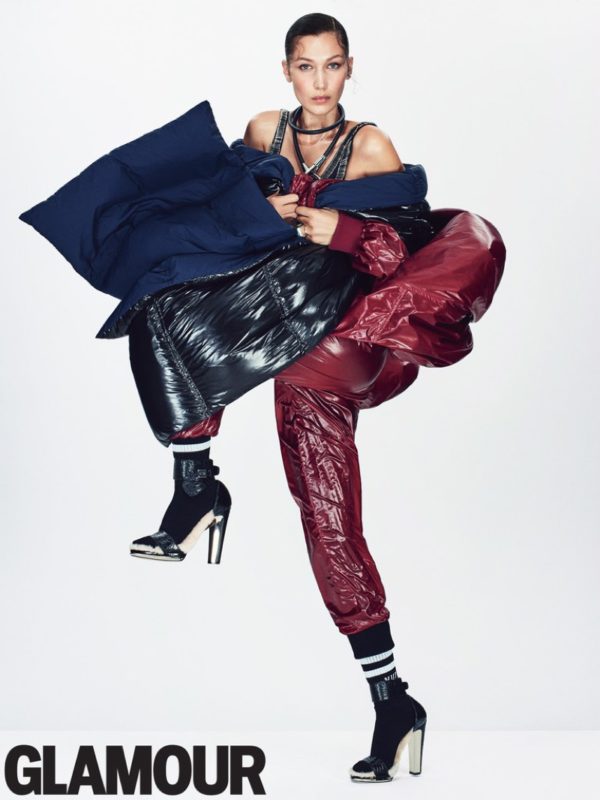 Bella Hadid layers up in DKNY coat, pants, puffer and scarf with Norma Kamali swimsuit