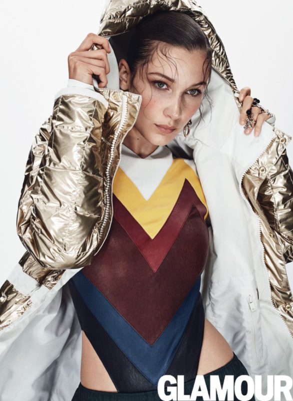 Bella Hadid wears L.A.M.B. x Burton jacket, Y:Project bodysuit, Holloway Sportswear pants, Alexander Wang earring and Dior rings