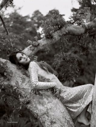 Posing in a tree, Lana Del Rey models Preen by Thornton Bregrazzi sequin dress