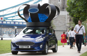 Brand new 2017 Ford Fiesta (Mk VII), given a regal makeover by royal milliner Rosie Olivia, travels over Tower Bridge in London adorned with crown of Fiesta parts celebrating the car’s track record as UK’s favourite car since 2008