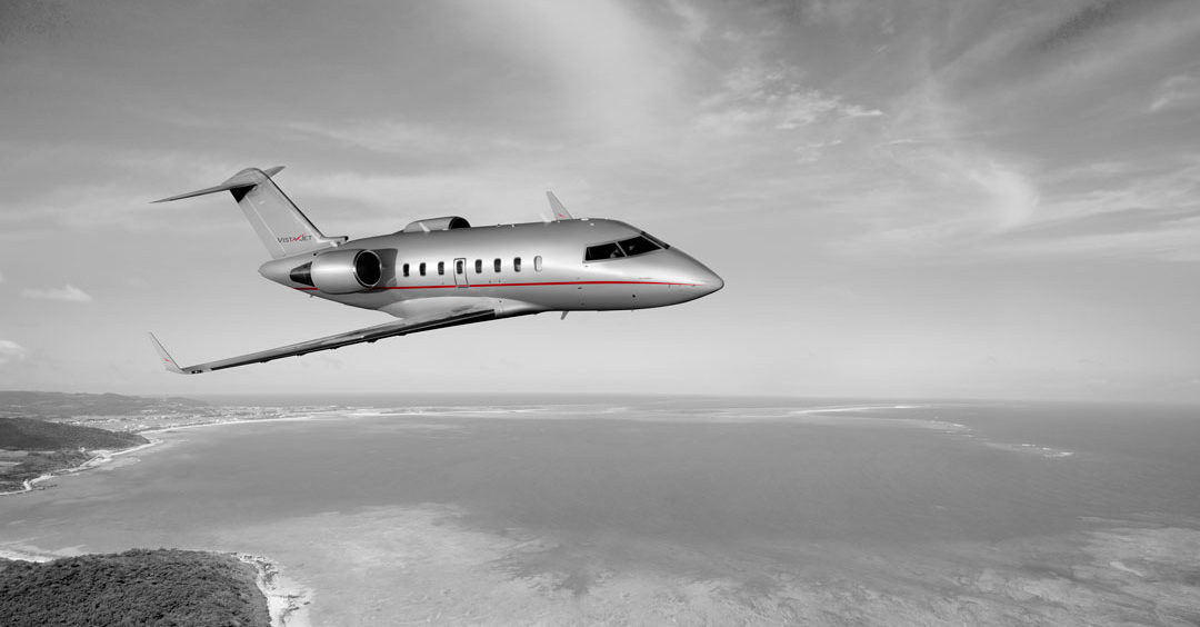 vistajet bombardier challenger 605-private-jet-in-flight