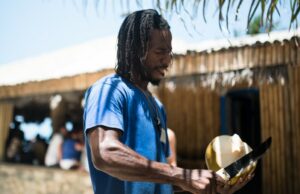 Yard Vibes – 5 insider’s tips for a fab Jamaican holiday man peeling coconut in Jamaica