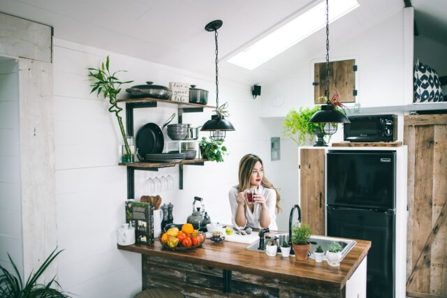 women sitting in the kitchen in a beautifully designed home