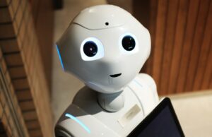 Will robots take my job? What do we fear most about the future of tech mini robot looking into a camera