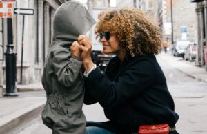 4 Tips for working parents woman holding kid at the street