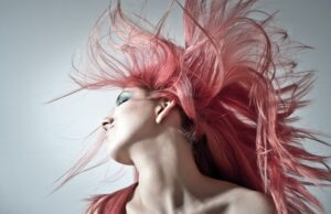 Women with flowing pink hair - Hair Extensions For Thin Hair