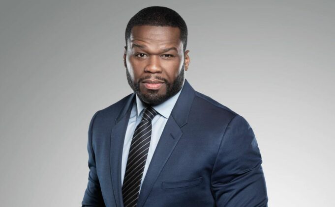 Photo of 50 Cent wearing a suit