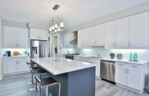 Solid stone: designer choices within your home Photo a white kitchen with solid stone centre isle