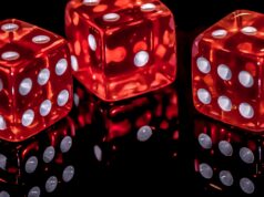 Photo of three red and white dice