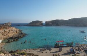 Does Swimming in the Blue Lagoon Really Reinvigorate the Soul? A photo of people swimming in the sea