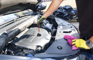 Navigating MOT Fines: Understanding Payment Deadlines and Automated Enforcement Systems Photo of a man unscrewing and engine bolt