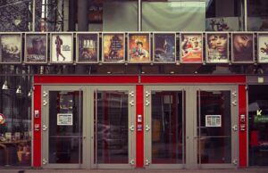 How to Design a Movie Poster: 8 Key Tips Movie theater, Movies, Entrance image