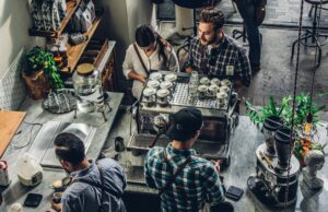 How To Know Your Go-To Winter Cafe Order Man buying coffee on a counter
