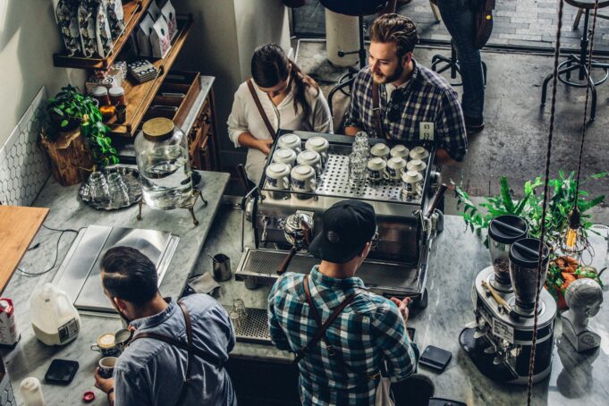 Man buying coffee on a counter