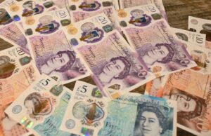 5 Signs That You Should Reduce Your Average Bet Size in Sports A pile of currency on a wooden table