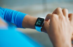 Which Brand Is No. 1 for Smart Watches? Man using a smart watch