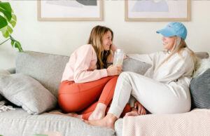 Autumn Nights In: Creating Warmth and Comfort at Home two women sitting at home on a couch