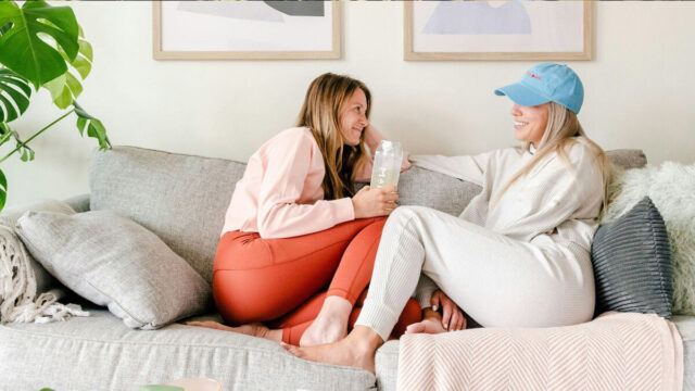 Autumn Nights In: Creating Warmth and Comfort at Home two women sitting at home on a couch