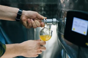 Person pouring beer from a tap