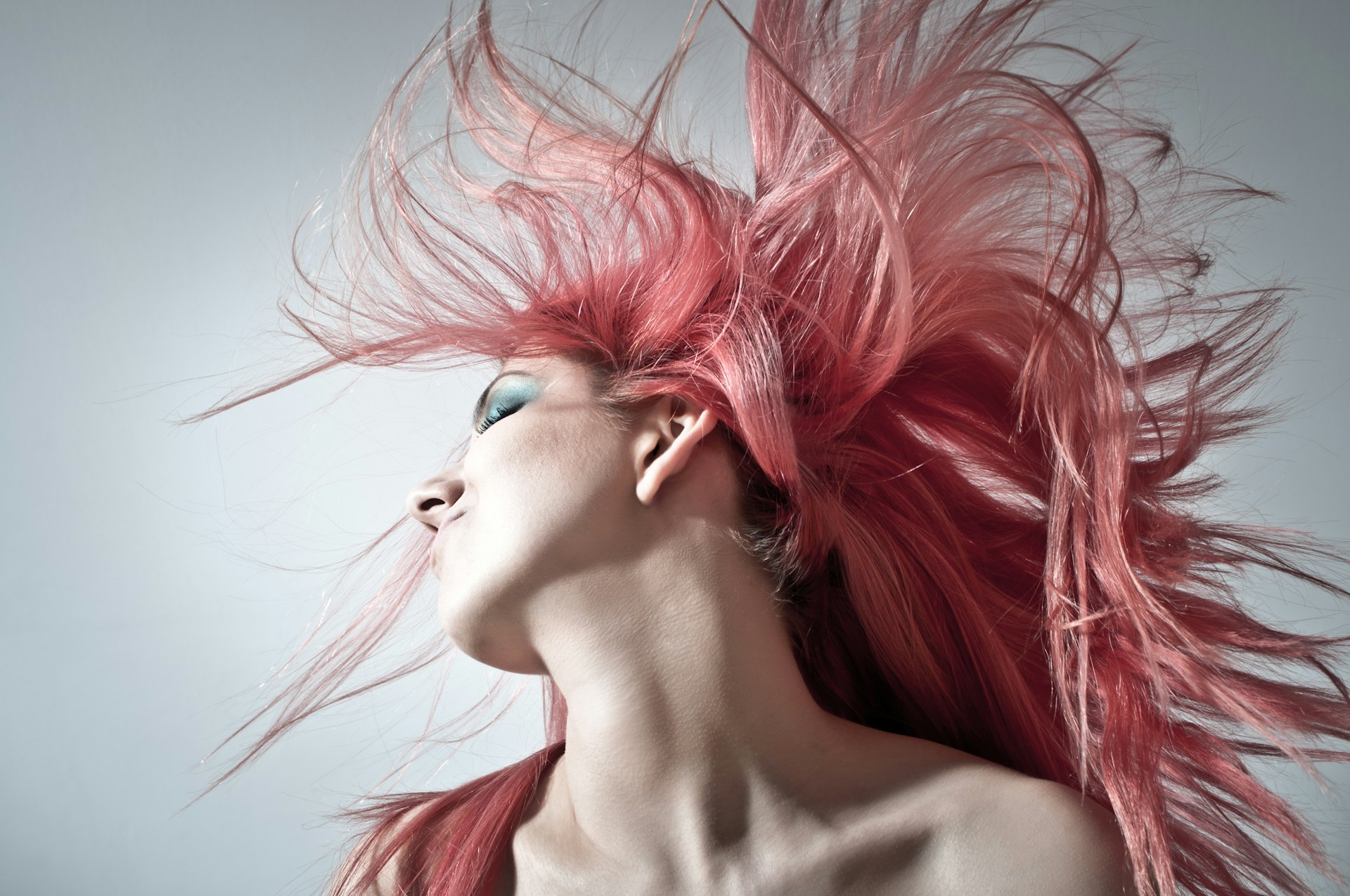 Woman waving her pink hair