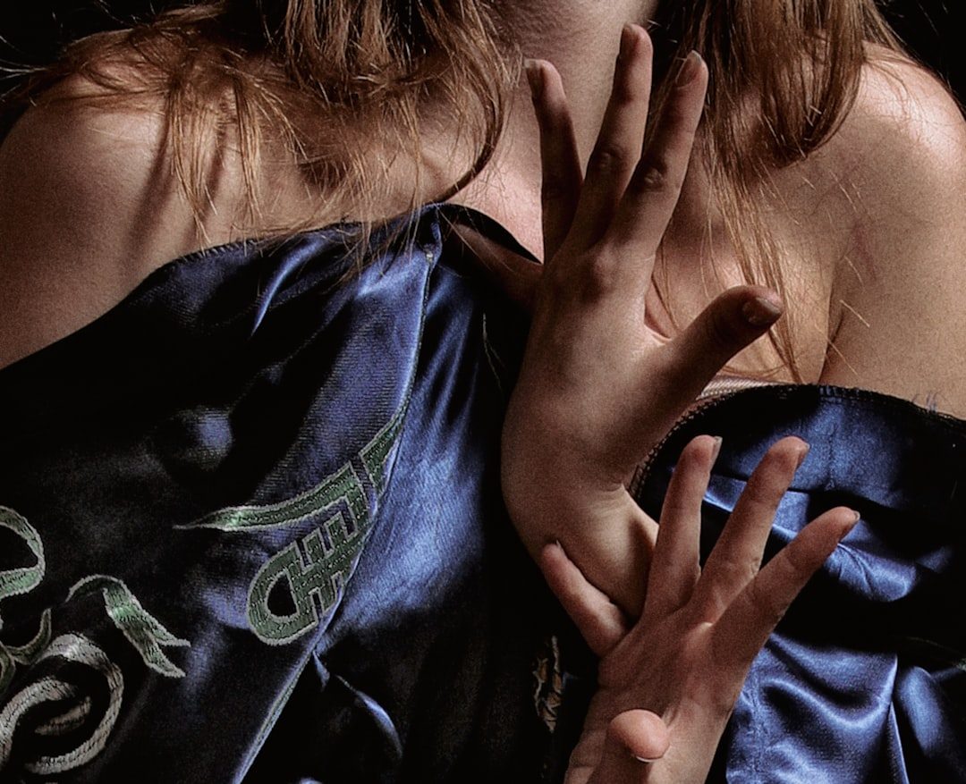 a person covering the face with the hands