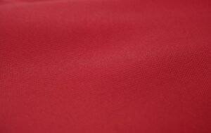 red textile in close up photography