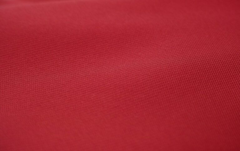 red textile in close up photography