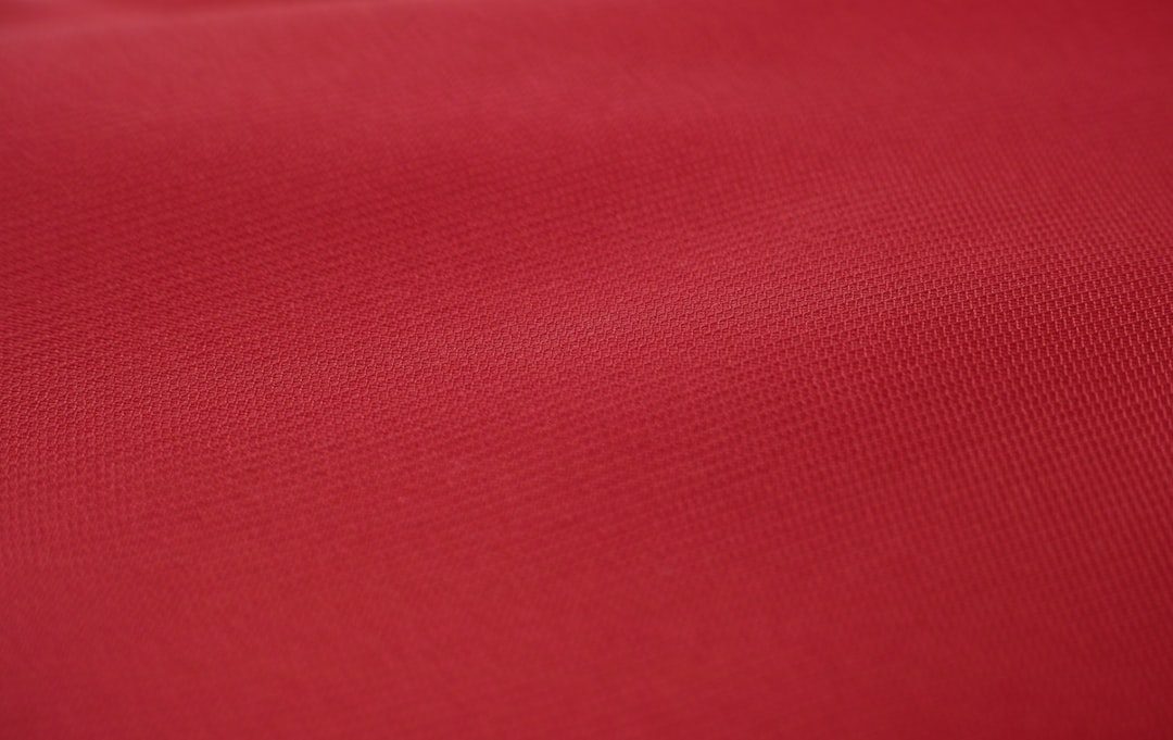 red textile in close up photography