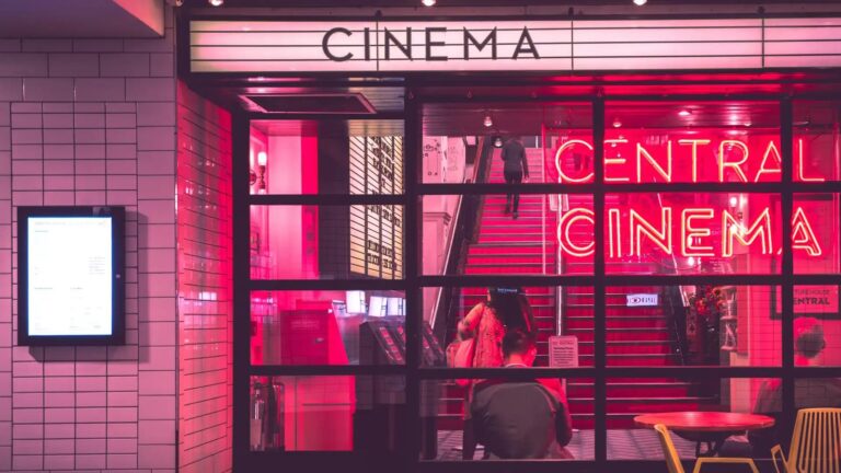 Modern cinema seating and atmospheric lighting inside a dark auditorium