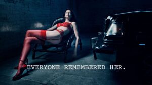 Irina Shayk in red Agent Provocateur lingerie and red stockings beside a black car, with the campaign line Everyone Remembered Her