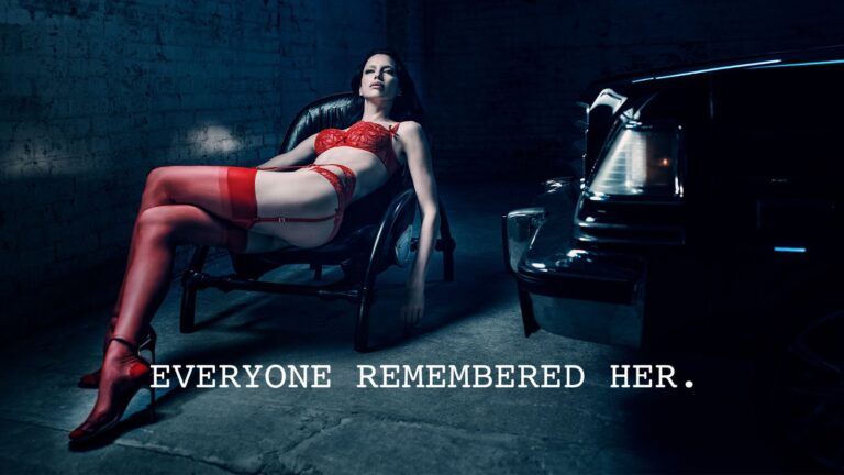 Irina Shayk in red Agent Provocateur lingerie and red stockings beside a black car, with the campaign line Everyone Remembered Her
