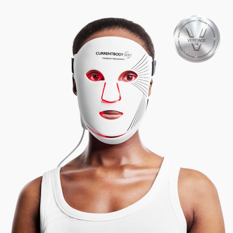 Model wearing the CurrentBody Skin LED Red Light Therapy Face Mask