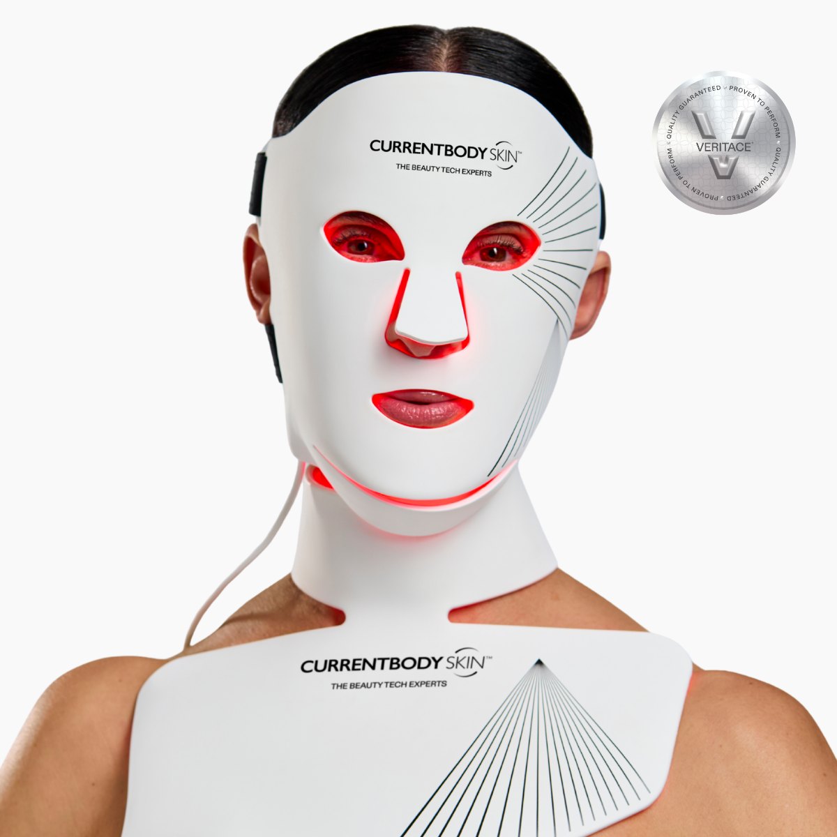 Model wearing the CurrentBody Skin LED Face and Neck Kit, the mask lit red