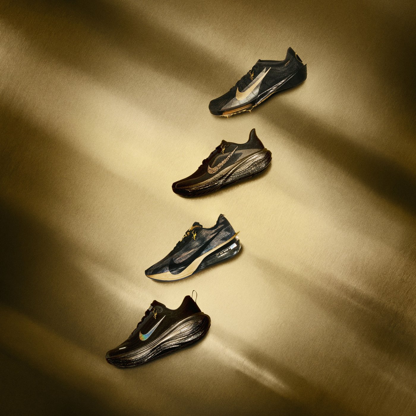 The four black and gold shoes in Keely Hodgkinson's Nike collection: Vomero Plus, Pegasus 42, Vaporfly 4 and Victory 2 spike